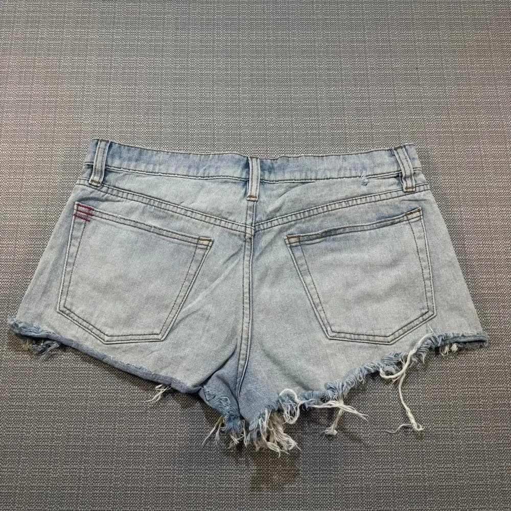 BDG Distressed blue denim shorts with frayed hem